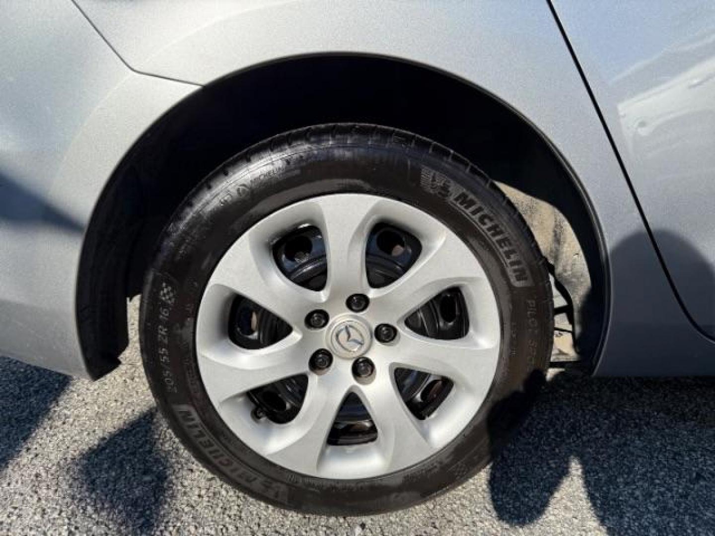 2013 Silver Mazda MAZDA3 i SV MT 4-Door (JM1BL1TF6D1) with an 2.0L L4 DOHC 16V engine, 5-Speed Manual transmission, located at 1806 Veterans Memorial Hwy SW, Austell, GA, 30168, (770) 944-9558, 33.817959, -84.606987 - Photo#16