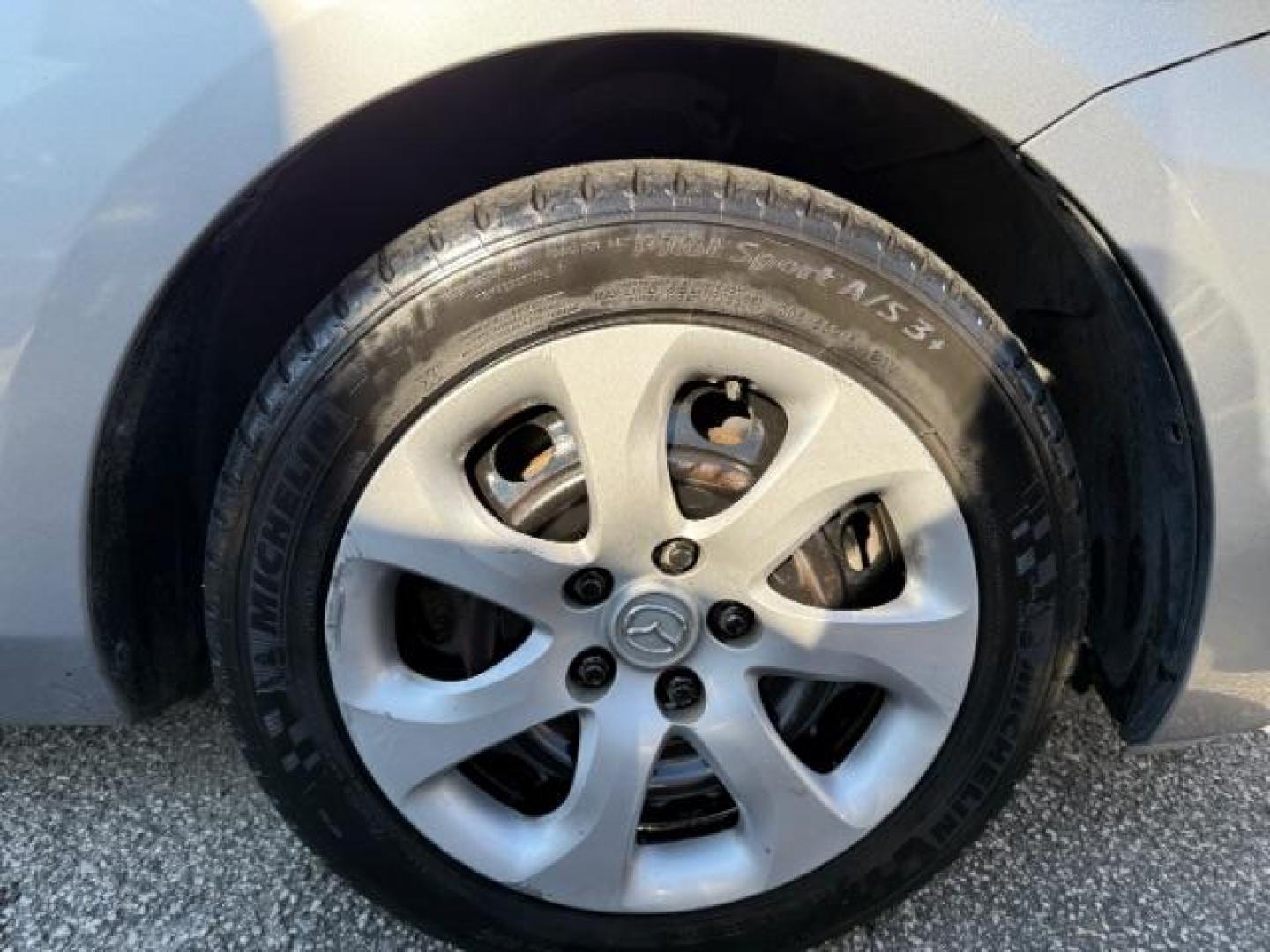 2013 Silver Mazda MAZDA3 i SV MT 4-Door (JM1BL1TF6D1) with an 2.0L L4 DOHC 16V engine, 5-Speed Manual transmission, located at 1806 Veterans Memorial Hwy SW, Austell, GA, 30168, (770) 944-9558, 33.817959, -84.606987 - Photo#17