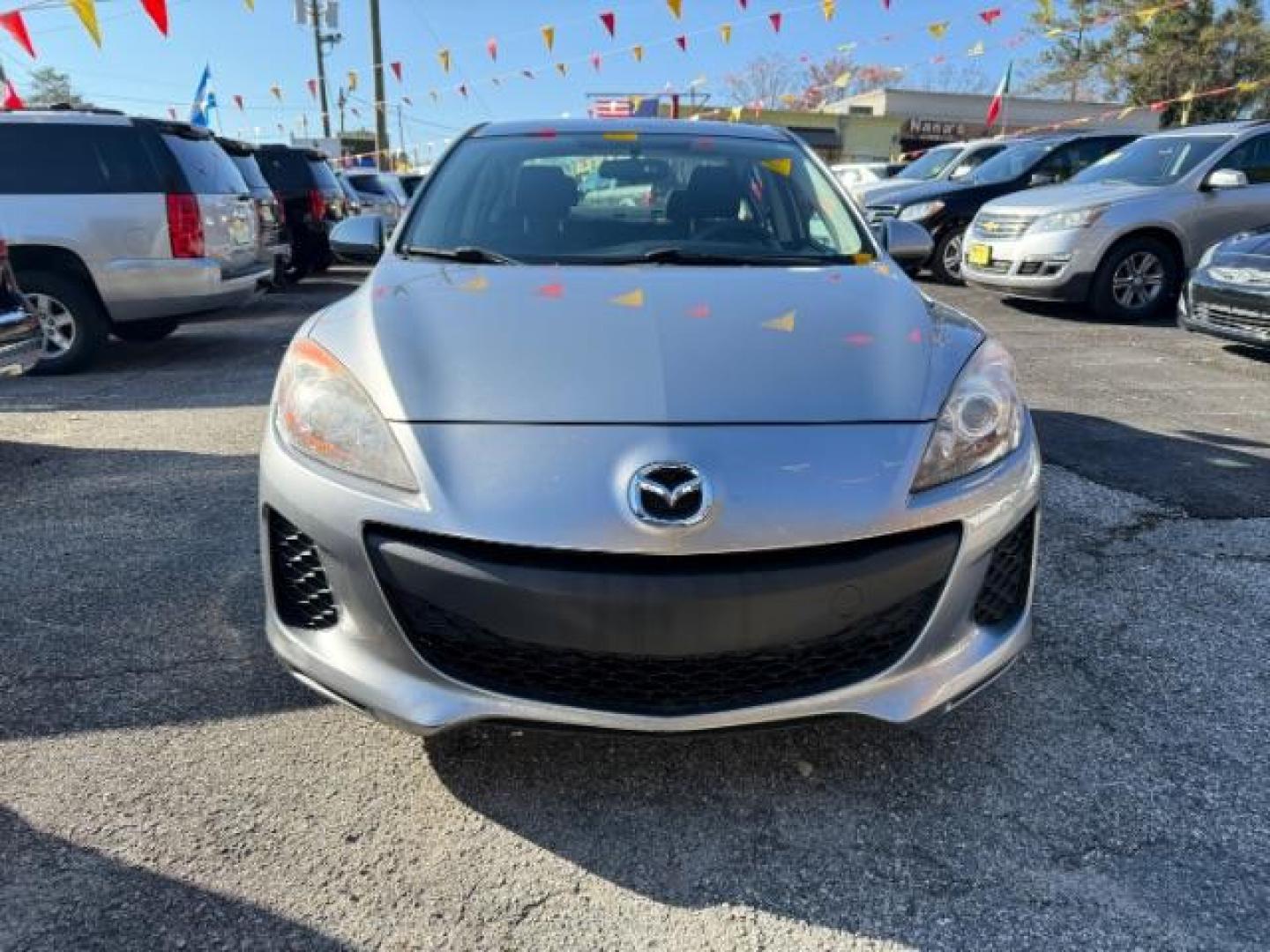 2013 Silver Mazda MAZDA3 i SV MT 4-Door (JM1BL1TF6D1) with an 2.0L L4 DOHC 16V engine, 5-Speed Manual transmission, located at 1806 Veterans Memorial Hwy SW, Austell, GA, 30168, (770) 944-9558, 33.817959, -84.606987 - Photo#1