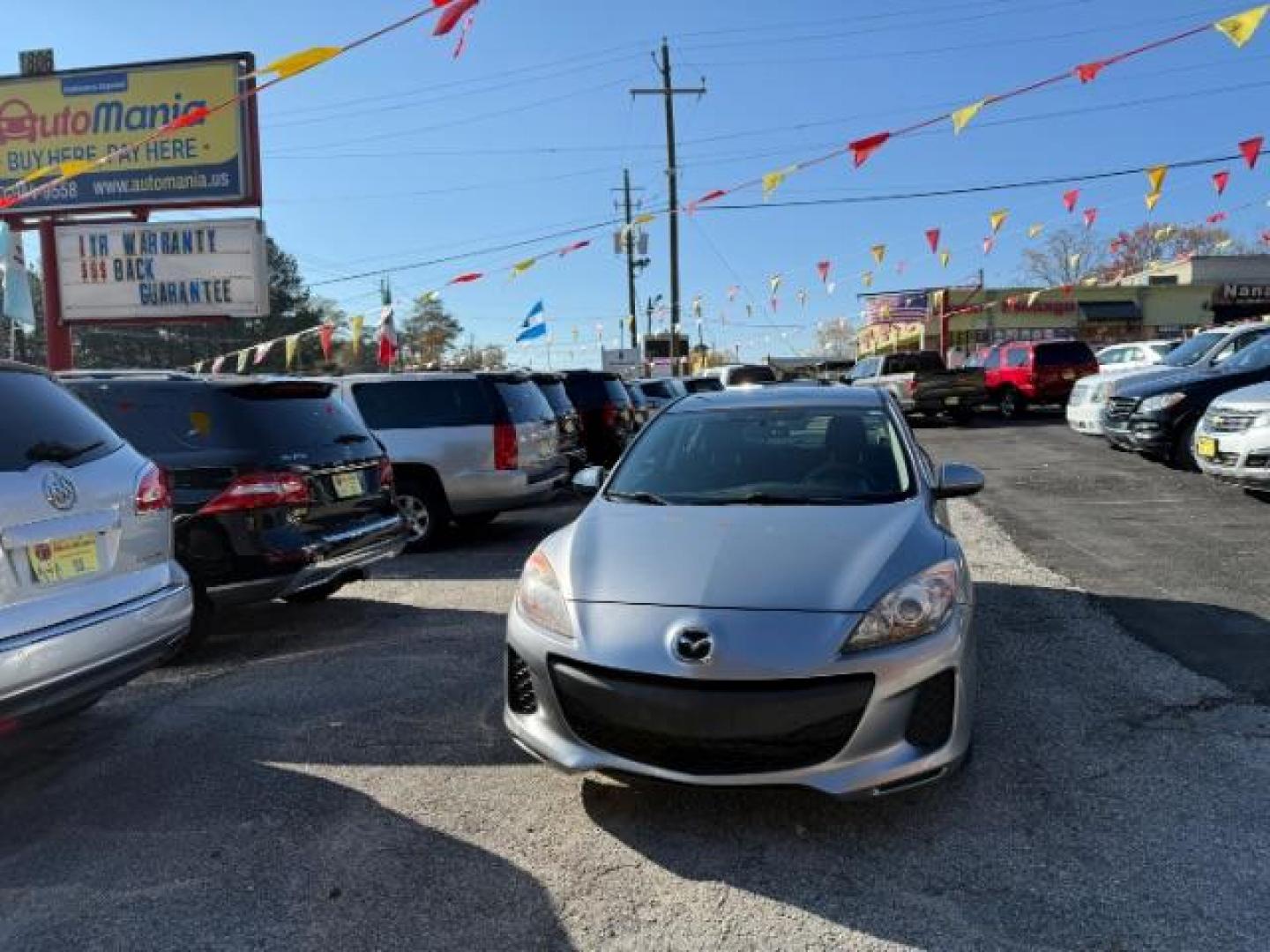 2013 Silver Mazda MAZDA3 i SV MT 4-Door (JM1BL1TF6D1) with an 2.0L L4 DOHC 16V engine, 5-Speed Manual transmission, located at 1806 Veterans Memorial Hwy SW, Austell, GA, 30168, (770) 944-9558, 33.817959, -84.606987 - Photo#2