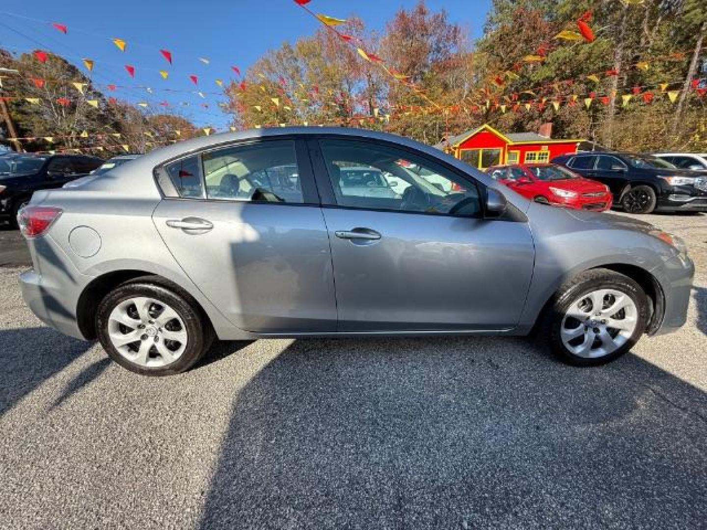 2013 Silver Mazda MAZDA3 i SV MT 4-Door (JM1BL1TF6D1) with an 2.0L L4 DOHC 16V engine, 5-Speed Manual transmission, located at 1806 Veterans Memorial Hwy SW, Austell, GA, 30168, (770) 944-9558, 33.817959, -84.606987 - Photo#4