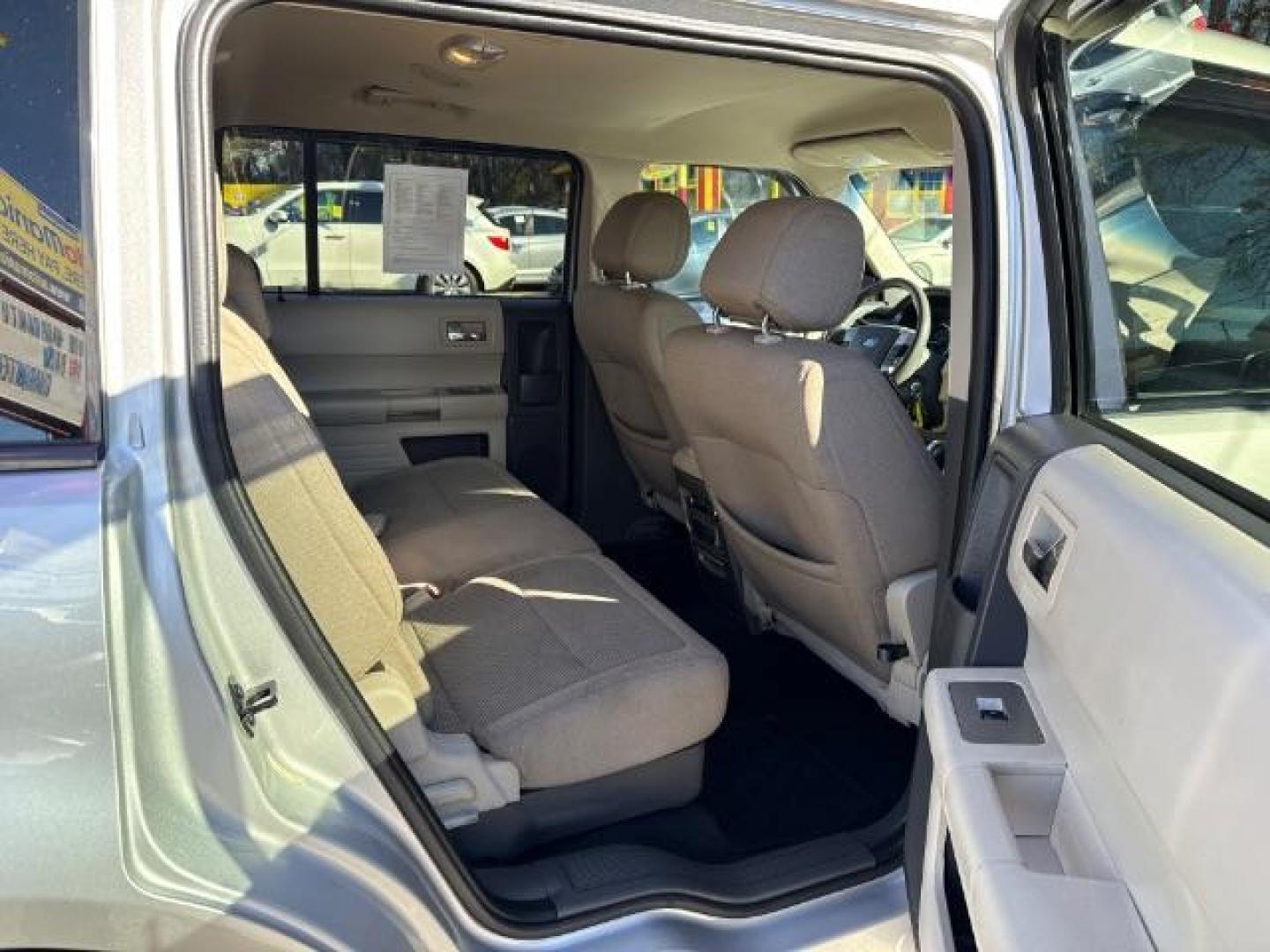 2012 Silver Ford Flex SE FWD (2FMGK5BC4CB) with an 3.5L V6 DOHC 24V engine, 6-Speed Automatic Overdrive transmission, located at 1806 Veterans Memorial Hwy SW, Austell, GA, 30168, (770) 944-9558, 33.817959, -84.606987 - Photo#8
