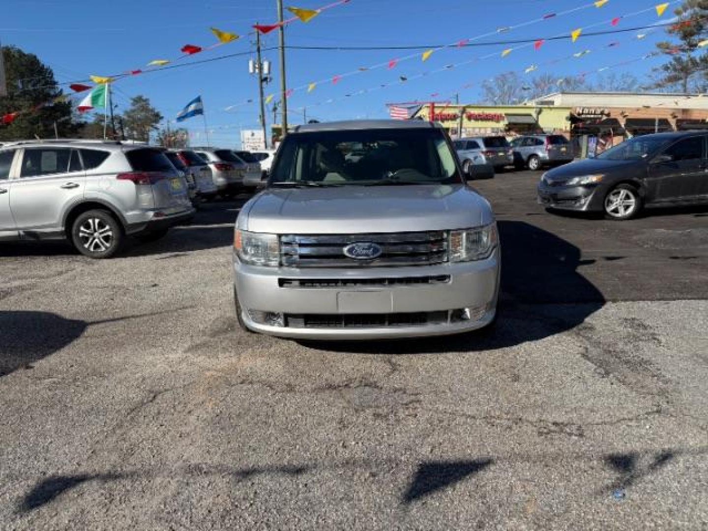 2012 Silver Ford Flex SE FWD (2FMGK5BC4CB) with an 3.5L V6 DOHC 24V engine, 6-Speed Automatic Overdrive transmission, located at 1806 Veterans Memorial Hwy SW, Austell, GA, 30168, (770) 944-9558, 33.817959, -84.606987 - Photo#1