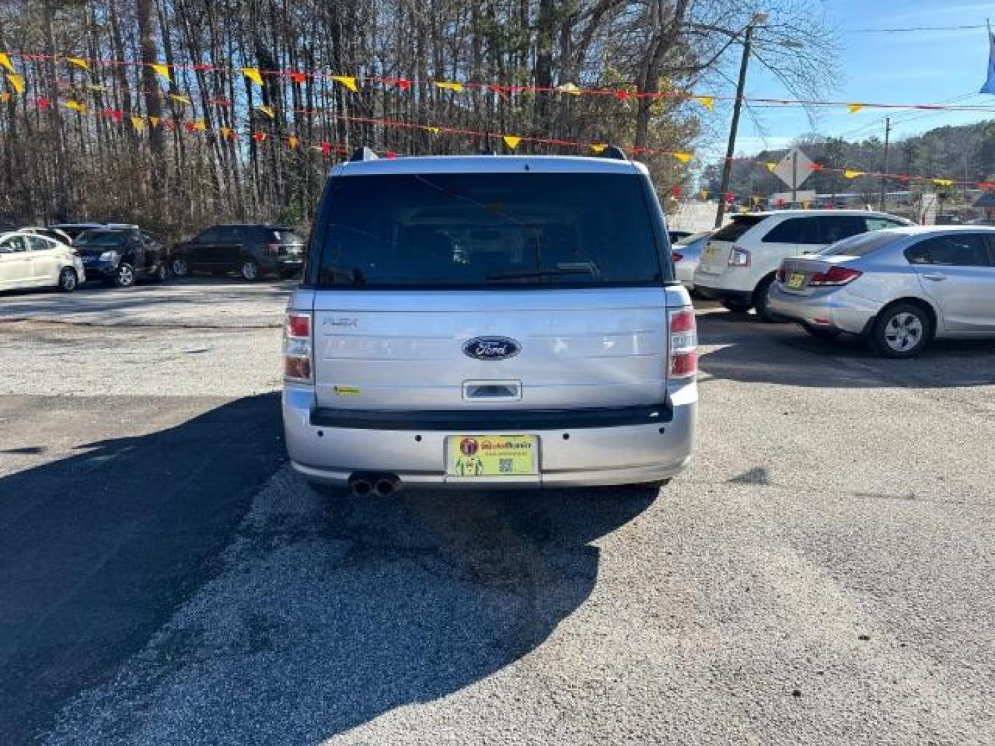 2012 Silver Ford Flex SE FWD (2FMGK5BC4CB) with an 3.5L V6 DOHC 24V engine, 6-Speed Automatic Overdrive transmission, located at 1806 Veterans Memorial Hwy SW, Austell, GA, 30168, (770) 944-9558, 33.817959, -84.606987 - Photo#4