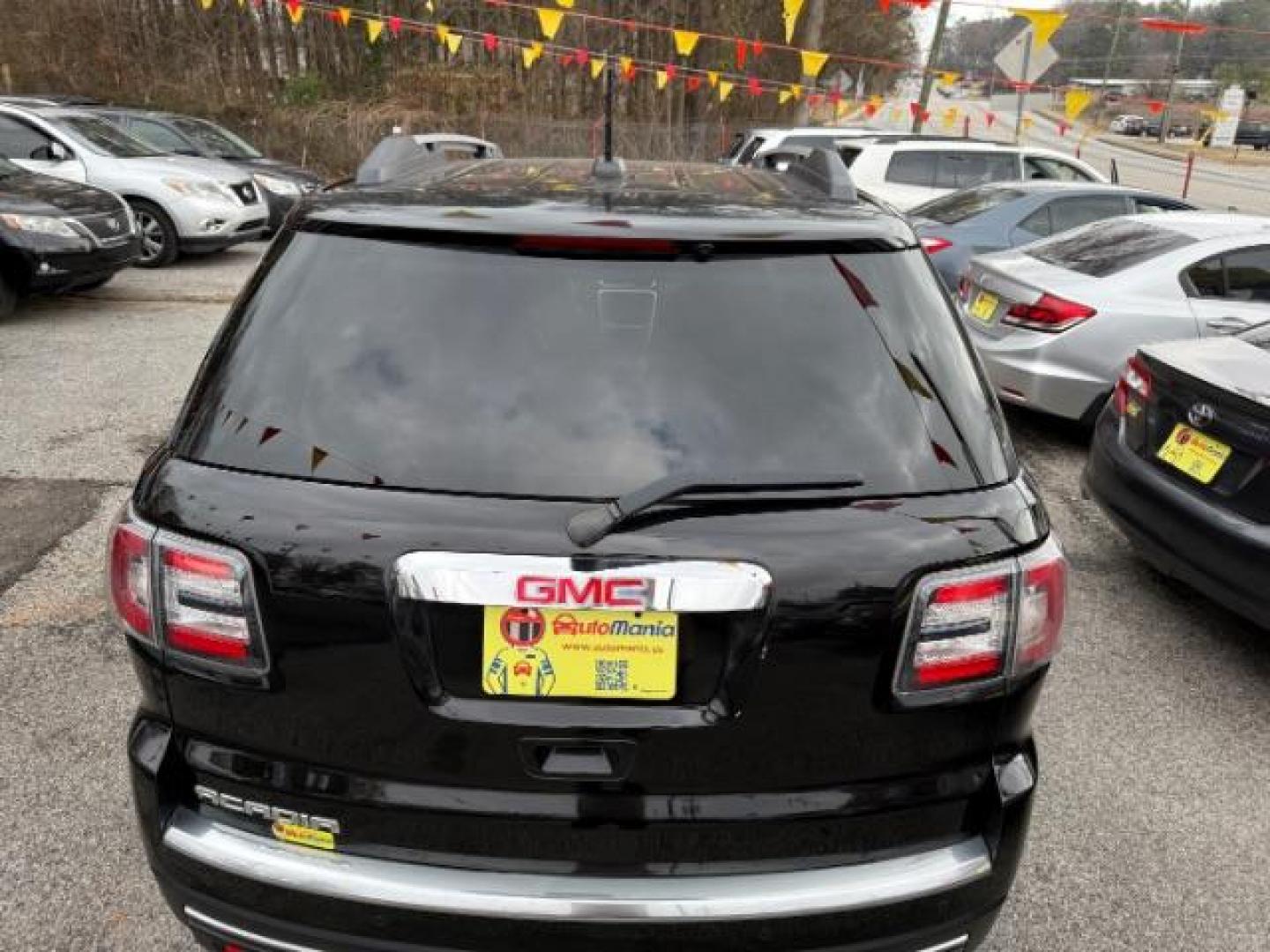 2016 Black GMC Acadia SLT-1 FWD (1GKKRRKD6GJ) with an 3.6L V6 DOHC 24V engine, 6-Speed Automatic transmission, located at 1806 Veterans Memorial Hwy SW, Austell, GA, 30168, (770) 944-9558, 33.817959, -84.606987 - Photo#3