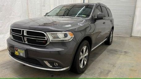2015 Gray Dodge Durango Limited 2WD (1C4RDHDG7FC) with an 3.6L V6 DOHC 24V engine, 8-Speed Automatic transmission, located at 1806 Veterans Memorial Hwy SW, Austell, GA, 30168, (770) 944-9558, 33.817959, -84.606987 - This Dodge Durango has passed a 100+ point inspection performed in our own service center. It's in great condition and runs awesome. The interior is really clean. The rear tires are new and the front tires are in good condition. The only blemish to note is a large dent on the rear quarter panel. Com- Photo#0