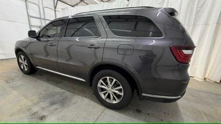 2015 Gray Dodge Durango Limited 2WD (1C4RDHDG7FC) with an 3.6L V6 DOHC 24V engine, 8-Speed Automatic transmission, located at 1806 Veterans Memorial Hwy SW, Austell, GA, 30168, (770) 944-9558, 33.817959, -84.606987 - This Dodge Durango has passed a 100+ point inspection performed in our own service center. It's in great condition and runs awesome. The interior is really clean. The rear tires are new and the front tires are in good condition. The only blemish to note is a large dent on the rear quarter panel. Com- Photo#2