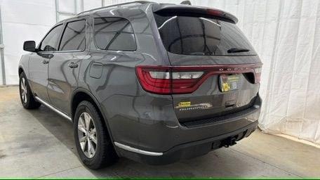 2015 Gray Dodge Durango Limited 2WD (1C4RDHDG7FC) with an 3.6L V6 DOHC 24V engine, 8-Speed Automatic transmission, located at 1806 Veterans Memorial Hwy SW, Austell, GA, 30168, (770) 944-9558, 33.817959, -84.606987 - This Dodge Durango has passed a 100+ point inspection performed in our own service center. It's in great condition and runs awesome. The interior is really clean. The rear tires are new and the front tires are in good condition. The only blemish to note is a large dent on the rear quarter panel. Com- Photo#3