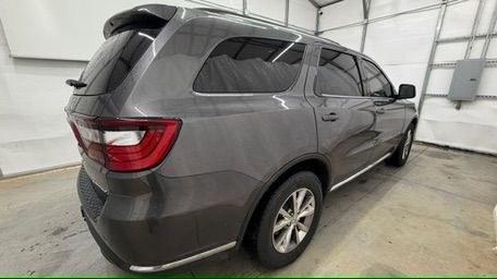 2015 Gray Dodge Durango Limited 2WD (1C4RDHDG7FC) with an 3.6L V6 DOHC 24V engine, 8-Speed Automatic transmission, located at 1806 Veterans Memorial Hwy SW, Austell, GA, 30168, (770) 944-9558, 33.817959, -84.606987 - This Dodge Durango has passed a 100+ point inspection performed in our own service center. It's in great condition and runs awesome. The interior is really clean. The rear tires are new and the front tires are in good condition. The only blemish to note is a large dent on the rear quarter panel. Com- Photo#7