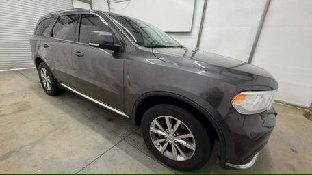 2015 Gray Dodge Durango Limited 2WD (1C4RDHDG7FC) with an 3.6L V6 DOHC 24V engine, 8-Speed Automatic transmission, located at 1806 Veterans Memorial Hwy SW, Austell, GA, 30168, (770) 944-9558, 33.817959, -84.606987 - This Dodge Durango has passed a 100+ point inspection performed in our own service center. It's in great condition and runs awesome. The interior is really clean. The rear tires are new and the front tires are in good condition. The only blemish to note is a large dent on the rear quarter panel. Com- Photo#8