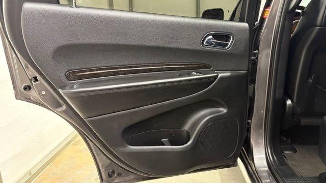 2015 Gray Dodge Durango Limited 2WD (1C4RDHDG7FC) with an 3.6L V6 DOHC 24V engine, 8-Speed Automatic transmission, located at 1806 Veterans Memorial Hwy SW, Austell, GA, 30168, (770) 944-9558, 33.817959, -84.606987 - This Dodge Durango has passed a 100+ point inspection performed in our own service center. It's in great condition and runs awesome. The interior is really clean. The rear tires are new and the front tires are in good condition. The only blemish to note is a large dent on the rear quarter panel. Com- Photo#14