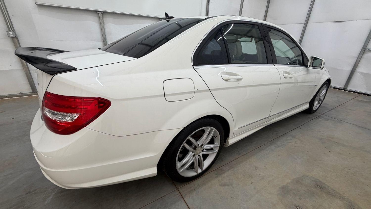 2012 White Mercedes Benz C Class C250 (WDDGF4HB1CR) with an 1.8L I-4 DI T/C I/C engine, located at 1806 Veterans Memorial Hwy SW, Austell, GA, 30168, (770) 944-9558, 33.817959, -84.606987 - Save money while riding with class in this Mercedes. The overall paint is good, with a couple of paint scrapes on the passenger door. The tires are in good condition, and the interior is in good shape; this is a non-smoking vehicle.- Photo#6