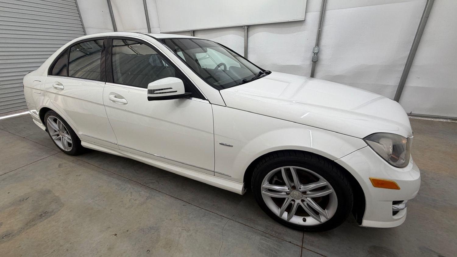 2012 White Mercedes Benz C Class C250 (WDDGF4HB1CR) with an 1.8L I-4 DI T/C I/C engine, located at 1806 Veterans Memorial Hwy SW, Austell, GA, 30168, (770) 944-9558, 33.817959, -84.606987 - Save money while riding with class in this Mercedes. The overall paint is good, with a couple of paint scrapes on the passenger door. The tires are in good condition, and the interior is in good shape; this is a non-smoking vehicle.- Photo#7