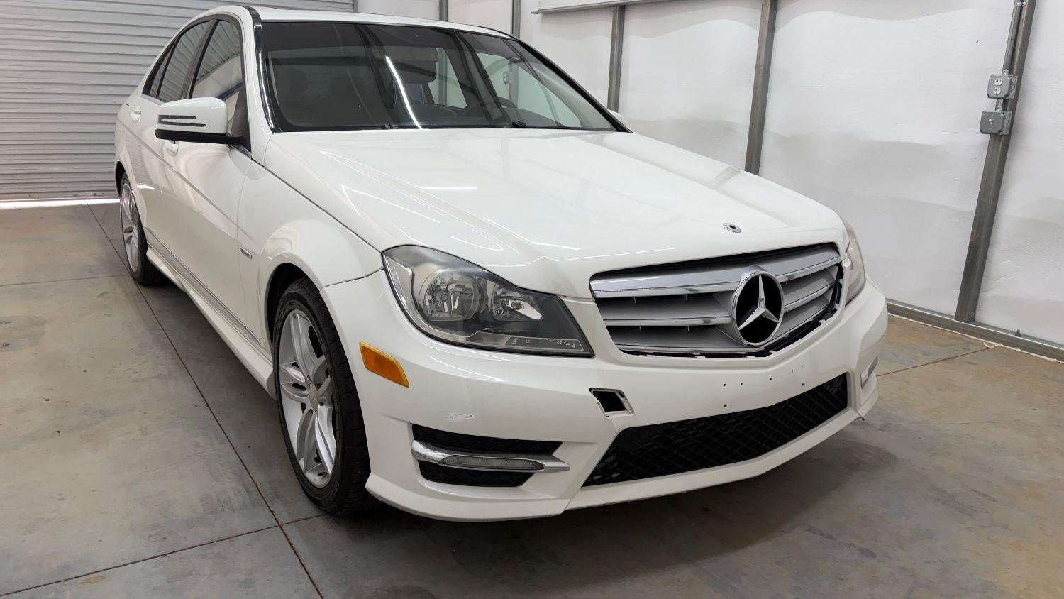 2012 White Mercedes Benz C Class C250 (WDDGF4HB1CR) with an 1.8L I-4 DI T/C I/C engine, located at 1806 Veterans Memorial Hwy SW, Austell, GA, 30168, (770) 944-9558, 33.817959, -84.606987 - Save money while riding with class in this Mercedes. The overall paint is good, with a couple of paint scrapes on the passenger door. The tires are in good condition, and the interior is in good shape; this is a non-smoking vehicle.- Photo#8