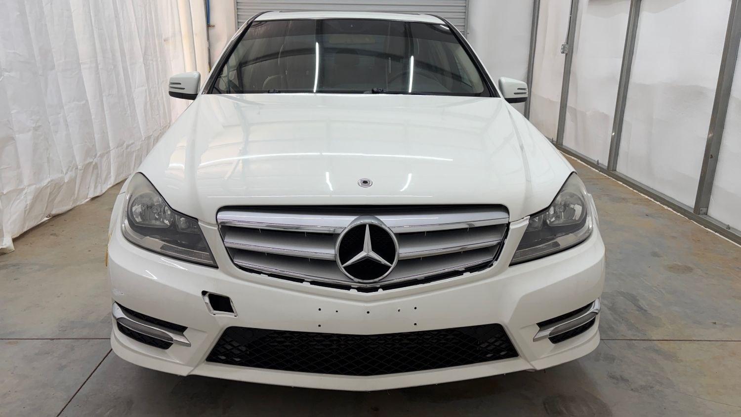 2012 White Mercedes Benz C Class C250 (WDDGF4HB1CR) with an 1.8L I-4 DI T/C I/C engine, located at 1806 Veterans Memorial Hwy SW, Austell, GA, 30168, (770) 944-9558, 33.817959, -84.606987 - Save money while riding with class in this Mercedes. The overall paint is good, with a couple of paint scrapes on the passenger door. The tires are in good condition, and the interior is in good shape; this is a non-smoking vehicle.- Photo#9