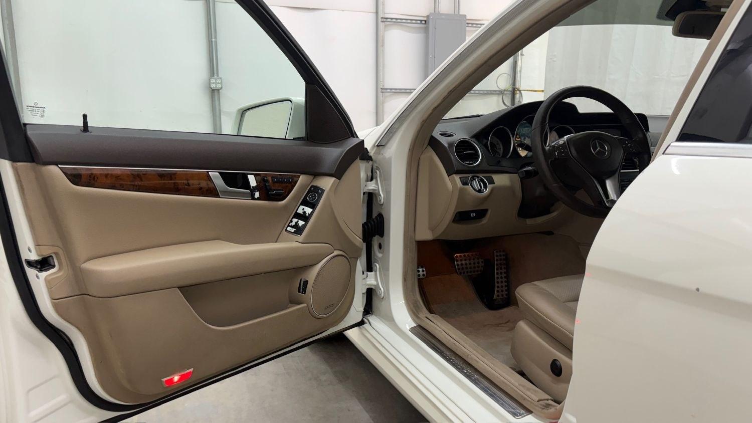 2012 White Mercedes Benz C Class C250 (WDDGF4HB1CR) with an 1.8L I-4 DI T/C I/C engine, located at 1806 Veterans Memorial Hwy SW, Austell, GA, 30168, (770) 944-9558, 33.817959, -84.606987 - Save money while riding with class in this Mercedes. The overall paint is good, with a couple of paint scrapes on the passenger door. The tires are in good condition, and the interior is in good shape; this is a non-smoking vehicle.- Photo#10
