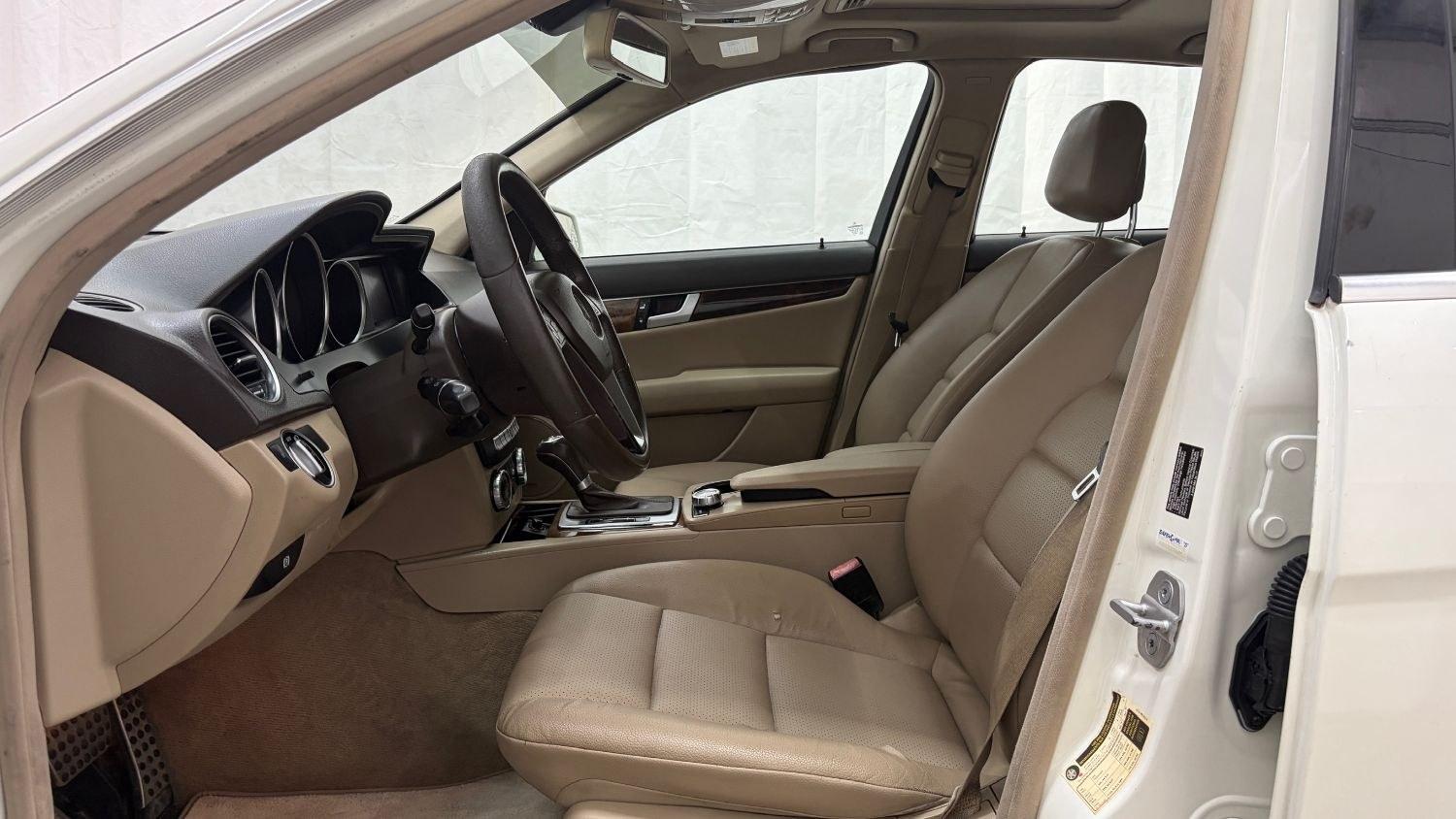 2012 White Mercedes Benz C Class C250 (WDDGF4HB1CR) with an 1.8L I-4 DI T/C I/C engine, located at 1806 Veterans Memorial Hwy SW, Austell, GA, 30168, (770) 944-9558, 33.817959, -84.606987 - Save money while riding with class in this Mercedes. The overall paint is good, with a couple of paint scrapes on the passenger door. The tires are in good condition, and the interior is in good shape; this is a non-smoking vehicle.- Photo#11