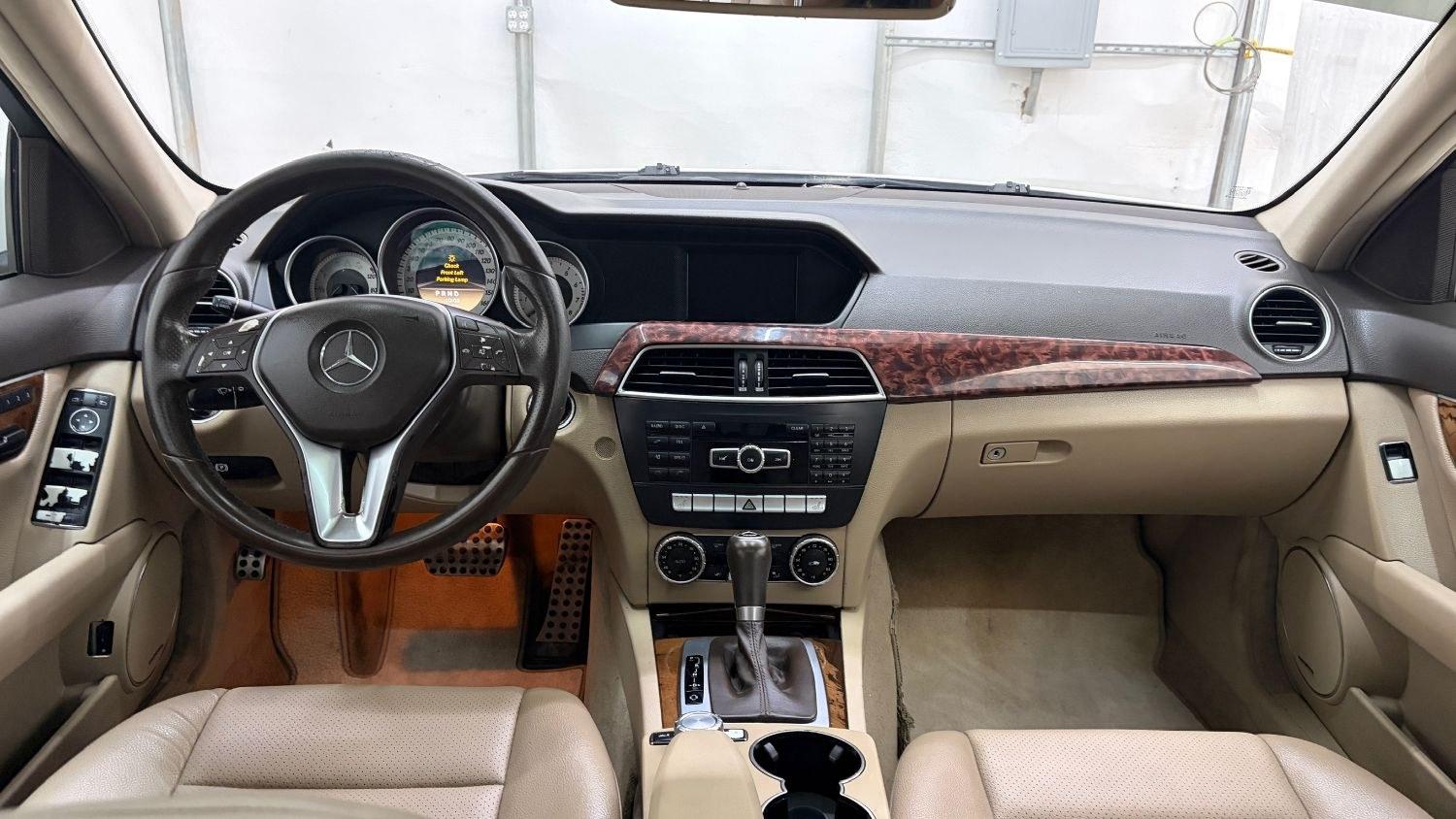 2012 White Mercedes Benz C Class C250 (WDDGF4HB1CR) with an 1.8L I-4 DI T/C I/C engine, located at 1806 Veterans Memorial Hwy SW, Austell, GA, 30168, (770) 944-9558, 33.817959, -84.606987 - Save money while riding with class in this Mercedes. The overall paint is good, with a couple of paint scrapes on the passenger door. The tires are in good condition, and the interior is in good shape; this is a non-smoking vehicle.- Photo#15