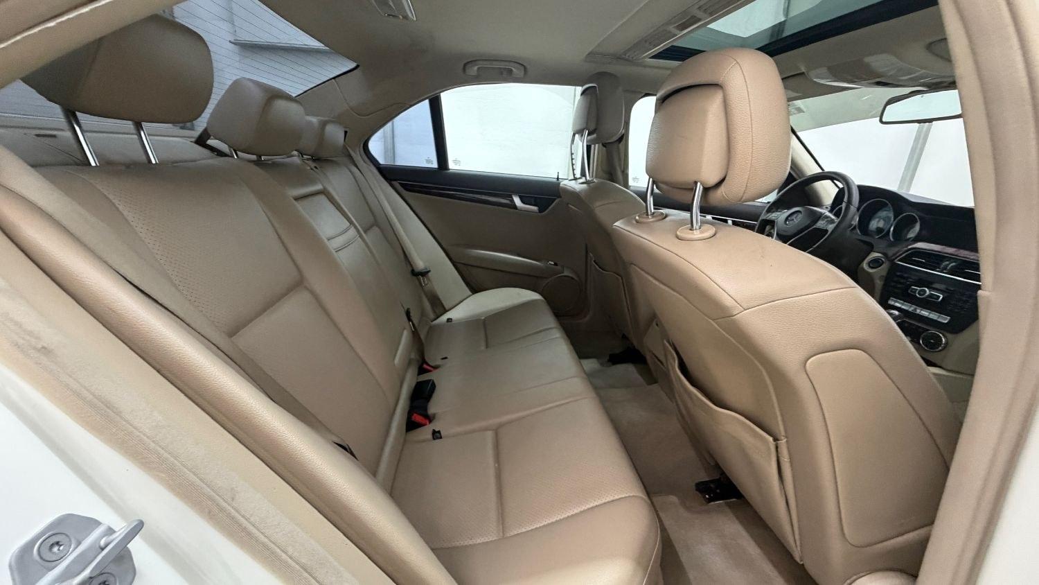 2012 White Mercedes Benz C Class C250 (WDDGF4HB1CR) with an 1.8L I-4 DI T/C I/C engine, located at 1806 Veterans Memorial Hwy SW, Austell, GA, 30168, (770) 944-9558, 33.817959, -84.606987 - Save money while riding with class in this Mercedes. The overall paint is good, with a couple of paint scrapes on the passenger door. The tires are in good condition, and the interior is in good shape; this is a non-smoking vehicle.- Photo#17