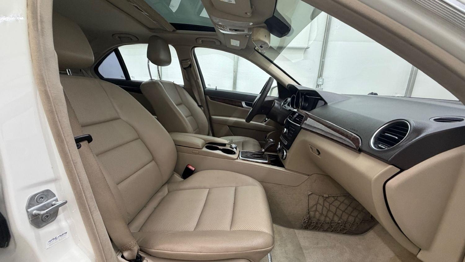 2012 White Mercedes Benz C Class C250 (WDDGF4HB1CR) with an 1.8L I-4 DI T/C I/C engine, located at 1806 Veterans Memorial Hwy SW, Austell, GA, 30168, (770) 944-9558, 33.817959, -84.606987 - Save money while riding with class in this Mercedes. The overall paint is good, with a couple of paint scrapes on the passenger door. The tires are in good condition, and the interior is in good shape; this is a non-smoking vehicle.- Photo#19
