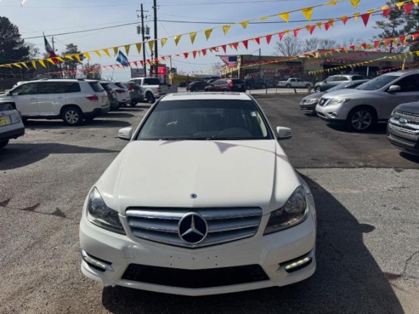 2012 White Mercedes Benz C Class C250 (WDDGF4HB1CR) with an 1.8L I-4 DI T/C I/C engine, located at 1806 Veterans Memorial Hwy SW, Austell, GA, 30168, (770) 944-9558, 33.817959, -84.606987 - Photo#1