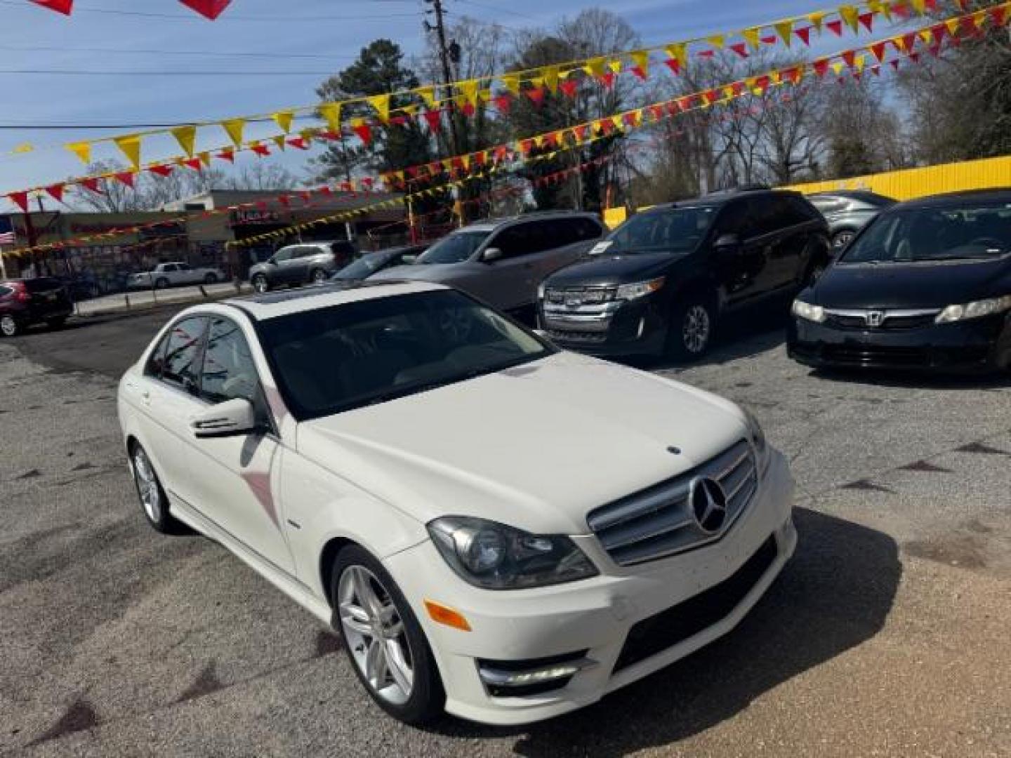 2012 White Mercedes Benz C Class C250 (WDDGF4HB1CR) with an 1.8L I-4 DI T/C I/C engine, located at 1806 Veterans Memorial Hwy SW, Austell, GA, 30168, (770) 944-9558, 33.817959, -84.606987 - Photo#2