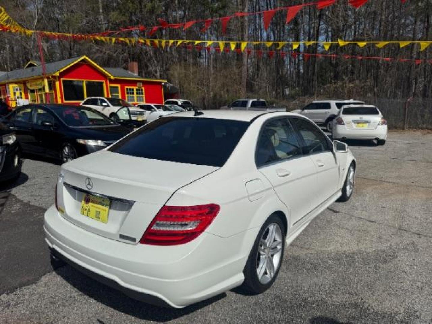 2012 White Mercedes Benz C Class C250 (WDDGF4HB1CR) with an 1.8L I-4 DI T/C I/C engine, located at 1806 Veterans Memorial Hwy SW, Austell, GA, 30168, (770) 944-9558, 33.817959, -84.606987 - Photo#3