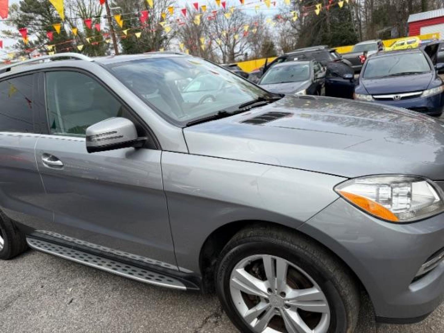 2015 Silver Mercedes-Benz M-Class ML350 (4JGDA5JB6FA) with an 3.5L V6 DOHC 24V engine, 7-Speed Automatic transmission, located at 1806 Veterans Memorial Hwy SW, Austell, GA, 30168, (770) 944-9558, 33.817959, -84.606987 - Photo#2