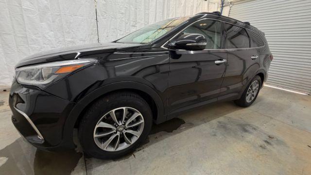 2018 Black Hyundai Santa Fe SE Ultimate (KM8SN4HF4JU) with an 3.3L V6 DOHC 24V engine, 6-Speed Automatic transmission, located at 1806 Veterans Memorial Hwy SW, Austell, GA, 30168, (770) 944-9558, 33.817959, -84.606987 - Photo#1