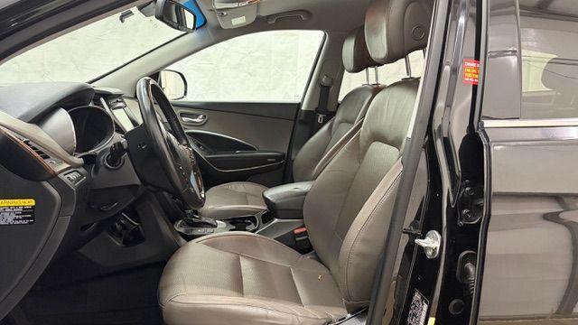 2018 Black Hyundai Santa Fe SE Ultimate (KM8SN4HF4JU) with an 3.3L V6 DOHC 24V engine, 6-Speed Automatic transmission, located at 1806 Veterans Memorial Hwy SW, Austell, GA, 30168, (770) 944-9558, 33.817959, -84.606987 - Photo#11