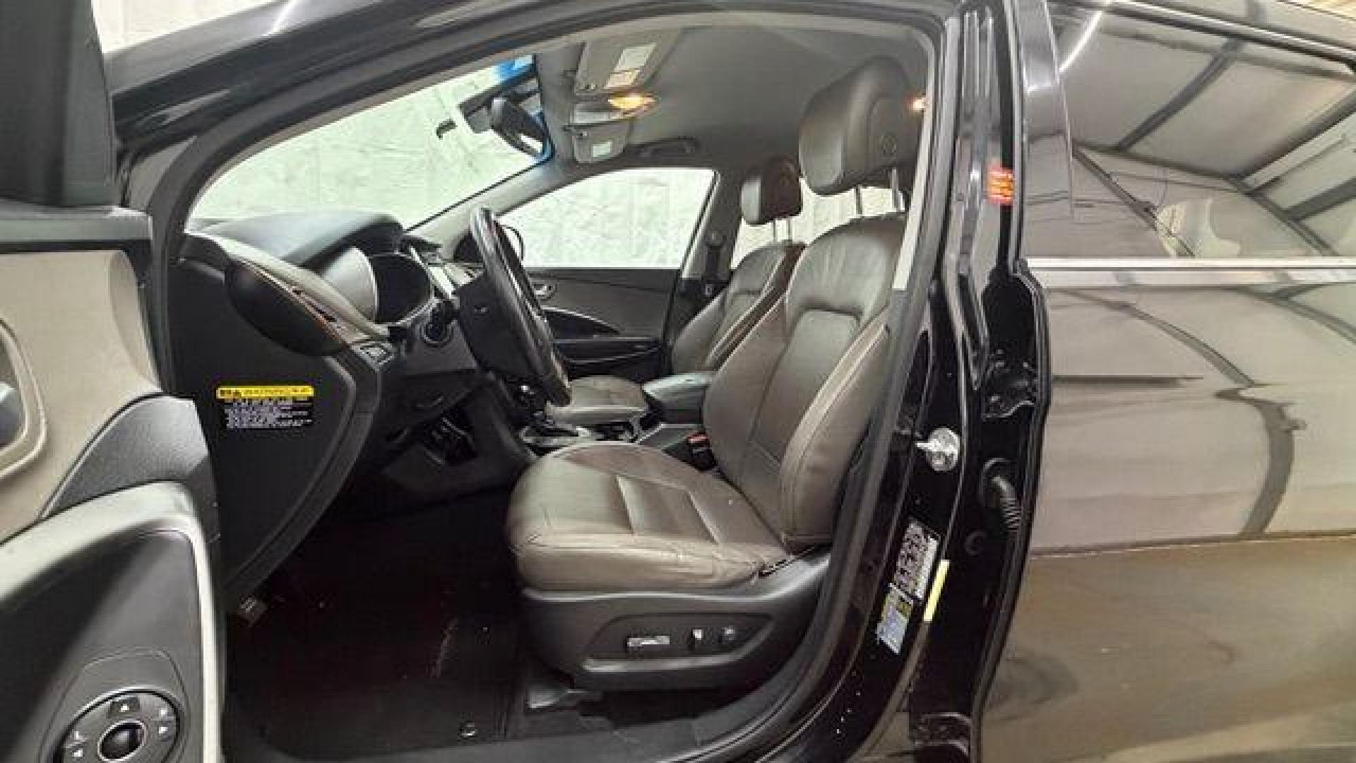 2018 Black Hyundai Santa Fe SE Ultimate (KM8SN4HF4JU) with an 3.3L V6 DOHC 24V engine, 6-Speed Automatic transmission, located at 1806 Veterans Memorial Hwy SW, Austell, GA, 30168, (770) 944-9558, 33.817959, -84.606987 - Photo#12