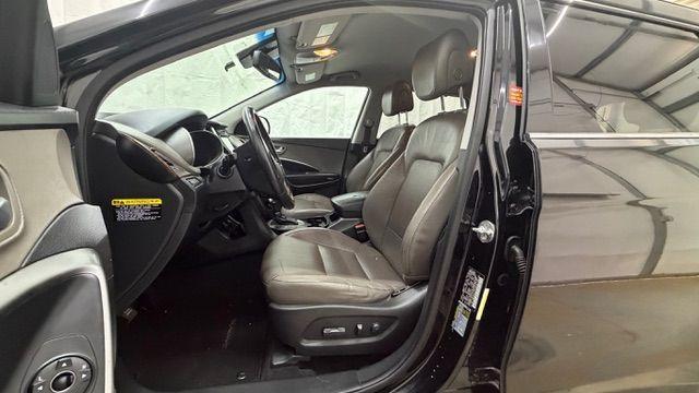 2018 Black Hyundai Santa Fe SE Ultimate (KM8SN4HF4JU) with an 3.3L V6 DOHC 24V engine, 6-Speed Automatic transmission, located at 1806 Veterans Memorial Hwy SW, Austell, GA, 30168, (770) 944-9558, 33.817959, -84.606987 - Photo#12