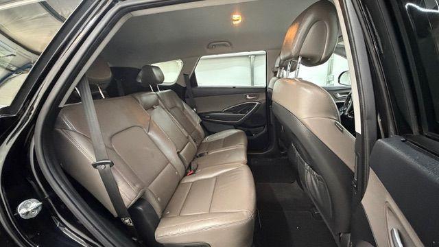 2018 Black Hyundai Santa Fe SE Ultimate (KM8SN4HF4JU) with an 3.3L V6 DOHC 24V engine, 6-Speed Automatic transmission, located at 1806 Veterans Memorial Hwy SW, Austell, GA, 30168, (770) 944-9558, 33.817959, -84.606987 - Photo#18