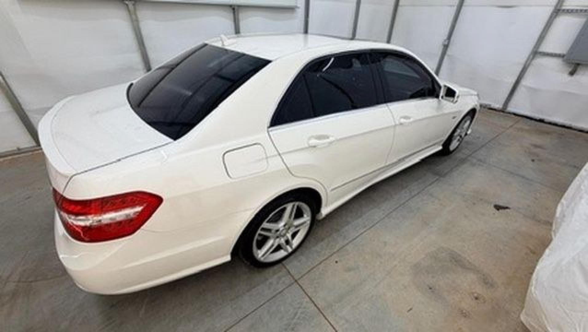 2012 White Mercedes-Benz E-Class E350 Sedan (WDDHF5KB0CA) with an 3.5L V6 DOHC 24V engine, 7-Speed Automatic transmission, located at 1806 Veterans Memorial Hwy SW, Austell, GA, 30168, (770) 944-9558, 33.817959, -84.606987 - This Benz E-Class has brand-new tires and a paint job in good condition. There is a small crack in the rear bumper. Inside, the interior is in good condition and smells great; it comes from a non-smoking vehicle. The seam on the driver's seat has a patch.- Photo#6