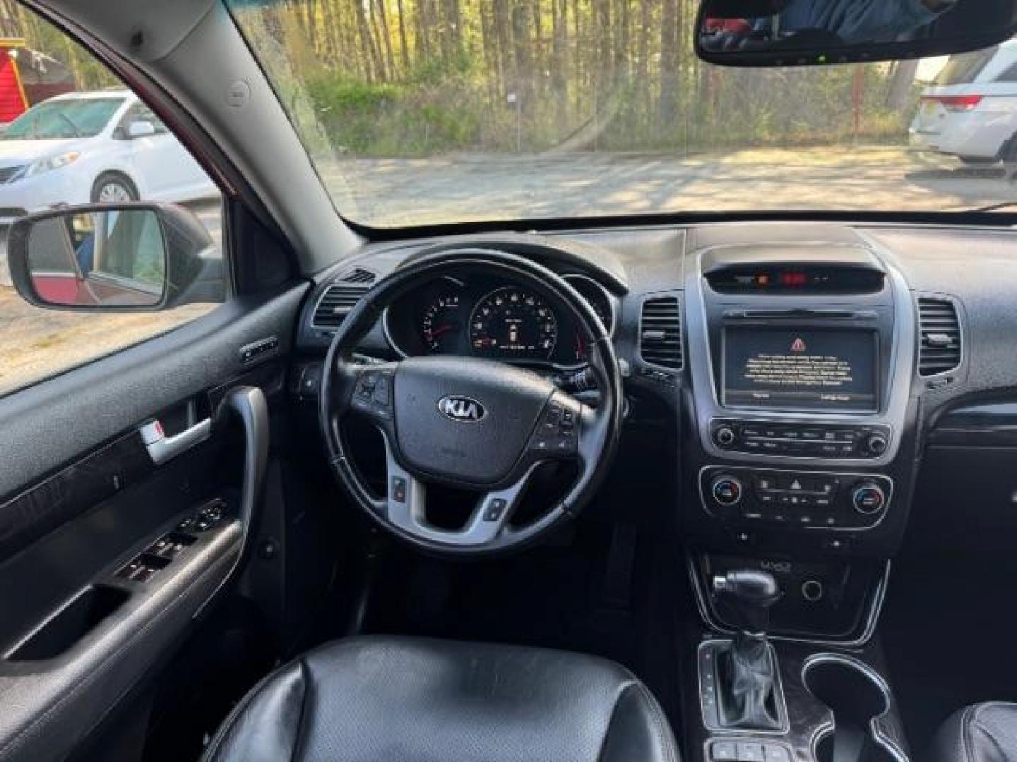 2015 Red Kia Sorento SX V6 FWD (5XYKW4A71FG) with an 3.3L V6 DOHC 24V engine, 6-Speed Automatic transmission, located at 1806 Veterans Memorial Hwy SW, Austell, GA, 30168, (770) 944-9558, 33.817959, -84.606987 - Photo#12