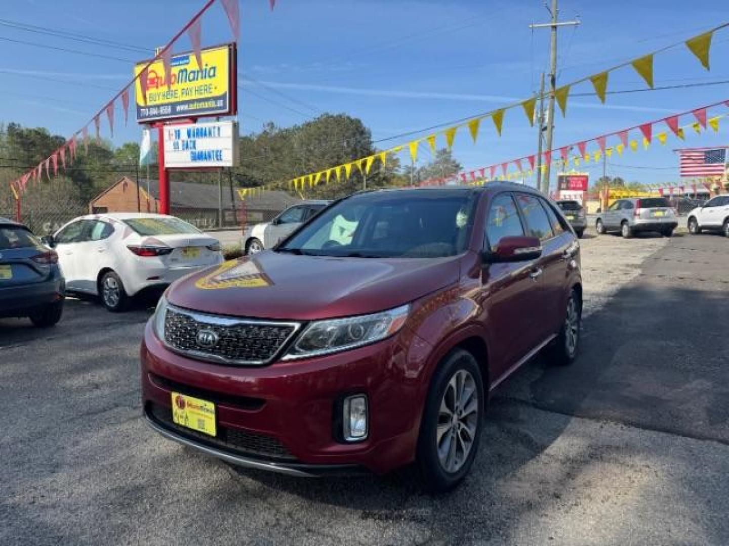 2015 Red Kia Sorento SX V6 FWD (5XYKW4A71FG) with an 3.3L V6 DOHC 24V engine, 6-Speed Automatic transmission, located at 1806 Veterans Memorial Hwy SW, Austell, GA, 30168, (770) 944-9558, 33.817959, -84.606987 - Photo#0