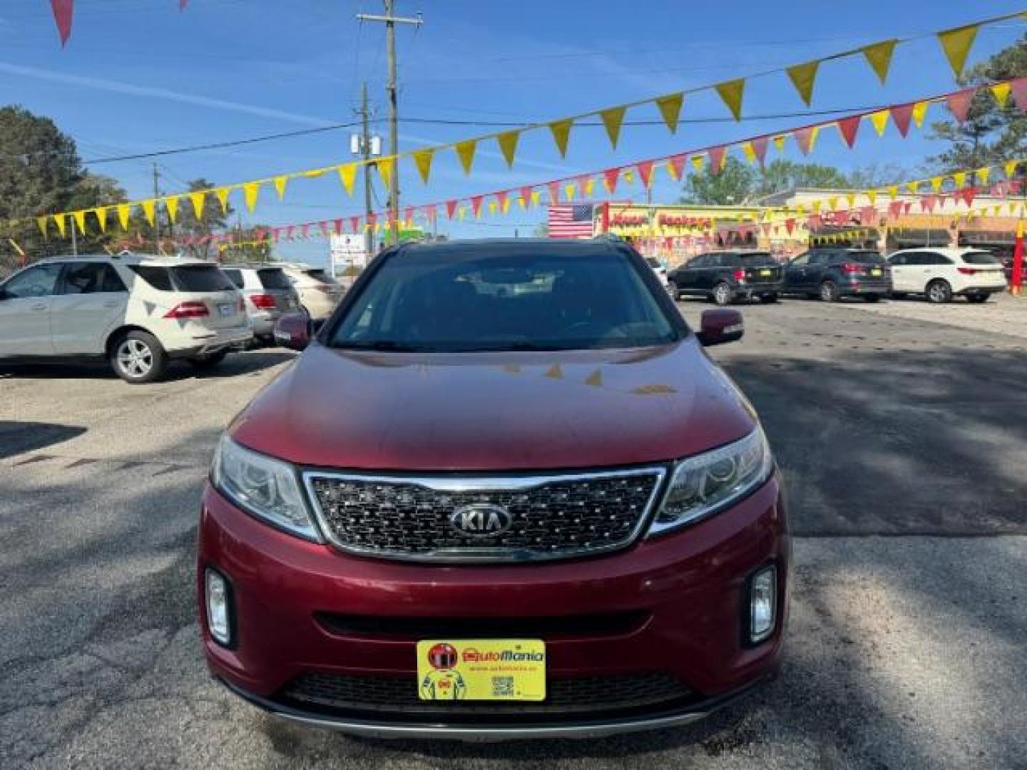 2015 Red Kia Sorento SX V6 FWD (5XYKW4A71FG) with an 3.3L V6 DOHC 24V engine, 6-Speed Automatic transmission, located at 1806 Veterans Memorial Hwy SW, Austell, GA, 30168, (770) 944-9558, 33.817959, -84.606987 - Photo#1