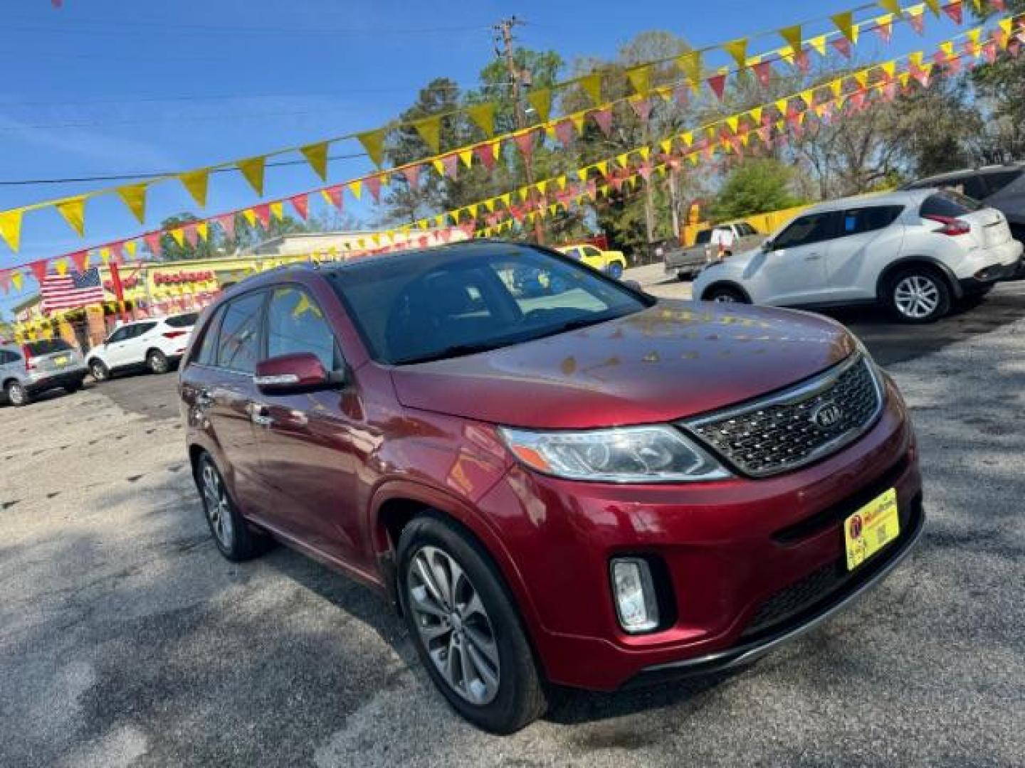 2015 Red Kia Sorento SX V6 FWD (5XYKW4A71FG) with an 3.3L V6 DOHC 24V engine, 6-Speed Automatic transmission, located at 1806 Veterans Memorial Hwy SW, Austell, GA, 30168, (770) 944-9558, 33.817959, -84.606987 - Photo#2
