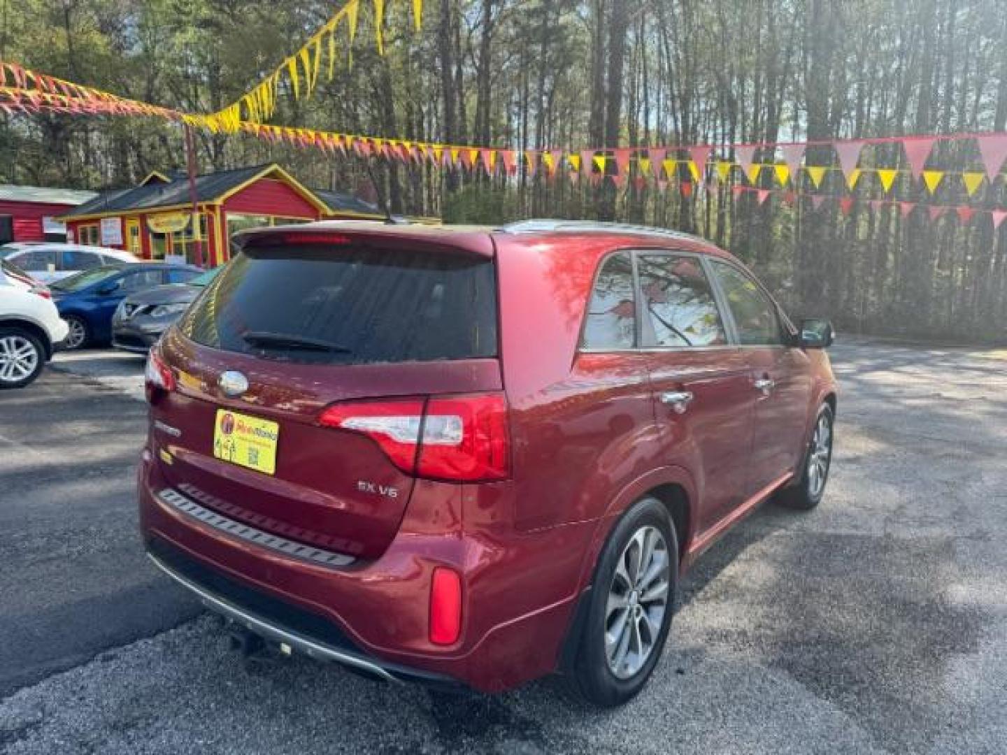 2015 Red Kia Sorento SX V6 FWD (5XYKW4A71FG) with an 3.3L V6 DOHC 24V engine, 6-Speed Automatic transmission, located at 1806 Veterans Memorial Hwy SW, Austell, GA, 30168, (770) 944-9558, 33.817959, -84.606987 - Photo#3