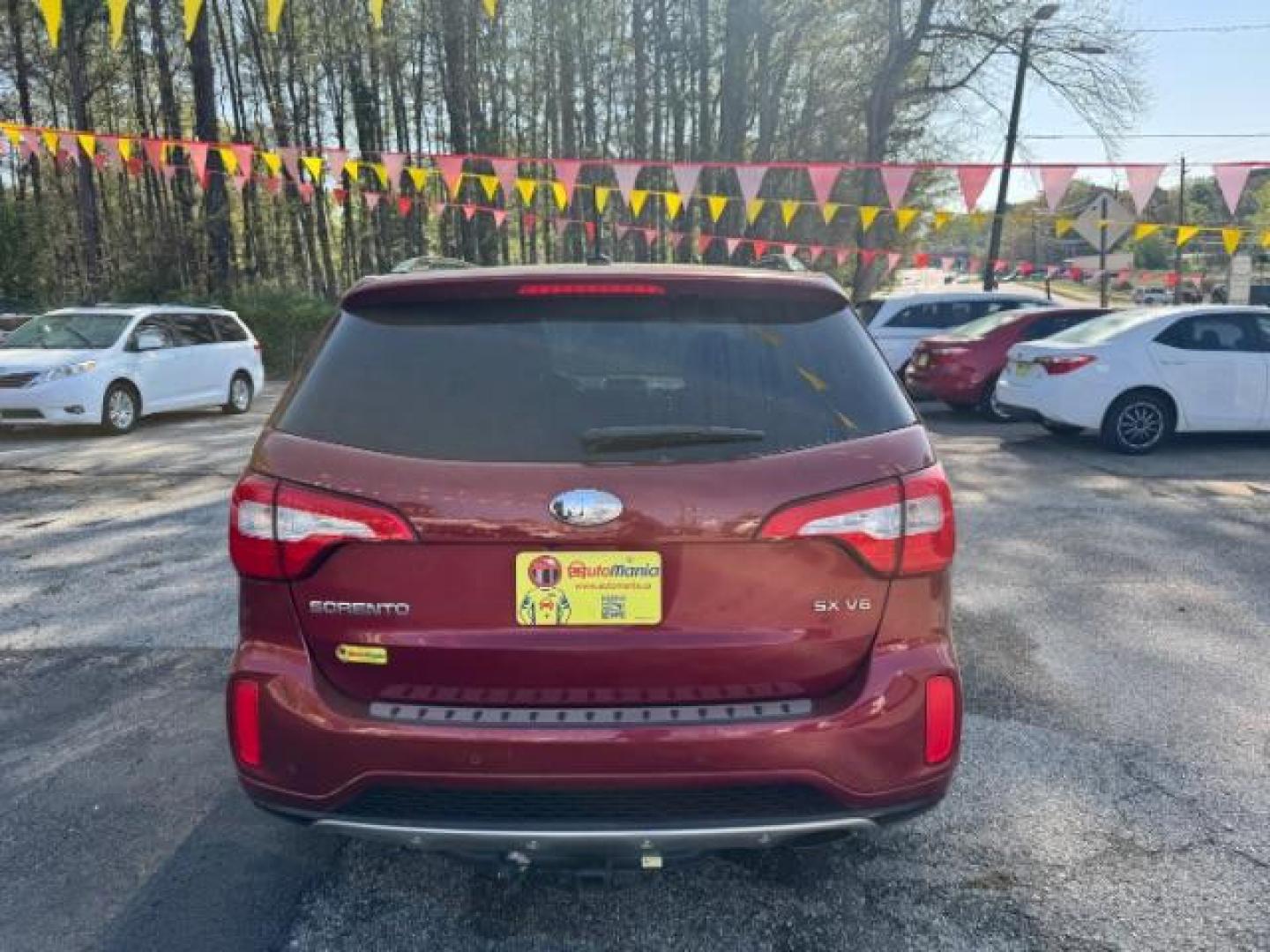 2015 Red Kia Sorento SX V6 FWD (5XYKW4A71FG) with an 3.3L V6 DOHC 24V engine, 6-Speed Automatic transmission, located at 1806 Veterans Memorial Hwy SW, Austell, GA, 30168, (770) 944-9558, 33.817959, -84.606987 - Photo#4