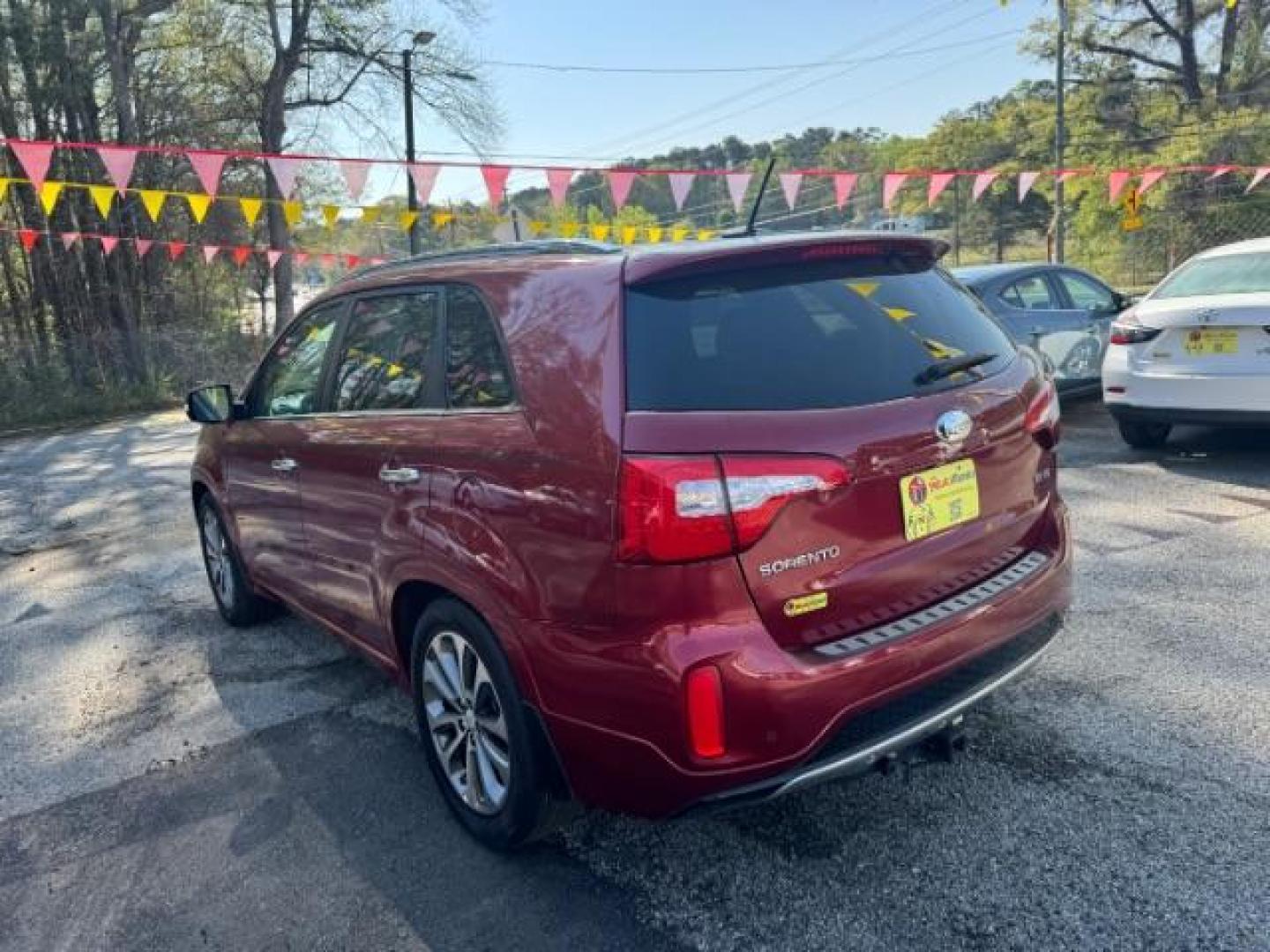 2015 Red Kia Sorento SX V6 FWD (5XYKW4A71FG) with an 3.3L V6 DOHC 24V engine, 6-Speed Automatic transmission, located at 1806 Veterans Memorial Hwy SW, Austell, GA, 30168, (770) 944-9558, 33.817959, -84.606987 - Photo#5