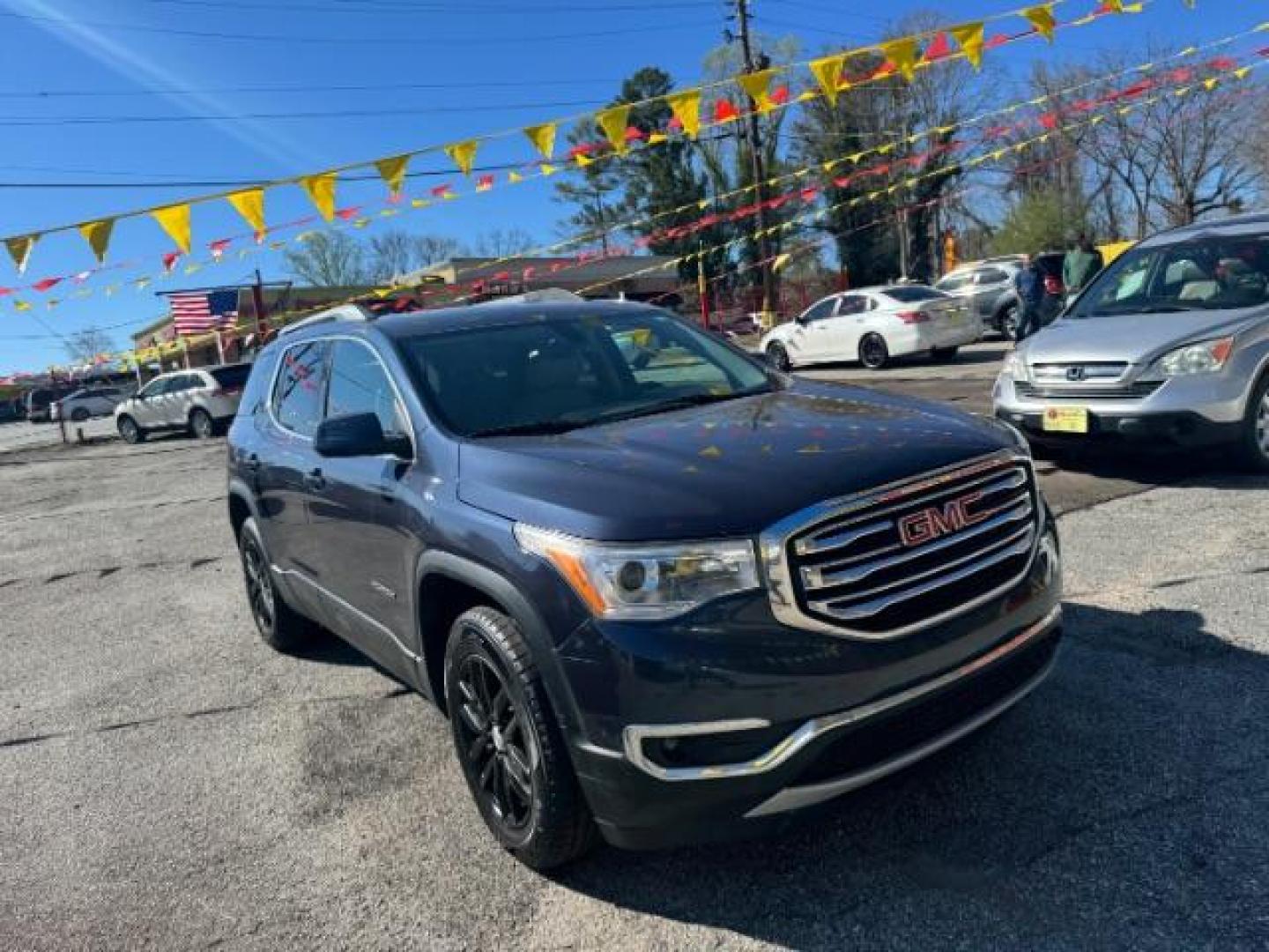 2019 Blue GMC Acadia SLT-1 (1GKKNMLS1KZ) with an 2.5L I-4 gasoline direct injection engine, Automatic transmission, located at 1806 Veterans Memorial Hwy SW, Austell, GA, 30168, (770) 944-9558, 33.817959, -84.606987 - Photo#2