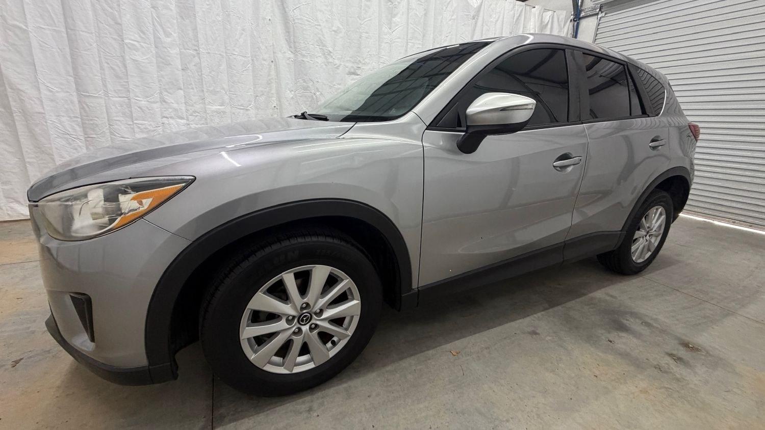 2015 Silver Mazda CX-5 Sport (JM3KE2BE0F0) with an 2.0L I-4 DI DOHC engine, located at 1806 Veterans Memorial Hwy SW, Austell, GA, 30168, (770) 944-9558, 33.817959, -84.606987- Photo#1