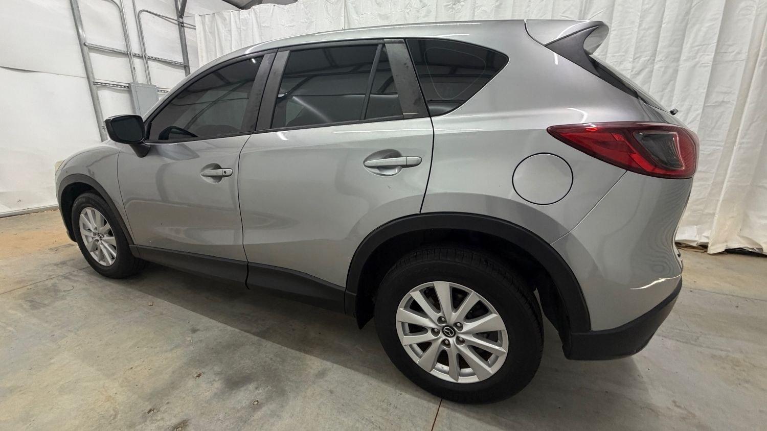 2015 Silver Mazda CX-5 Sport (JM3KE2BE0F0) with an 2.0L I-4 DI DOHC engine, located at 1806 Veterans Memorial Hwy SW, Austell, GA, 30168, (770) 944-9558, 33.817959, -84.606987- Photo#2