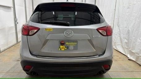 2015 Silver Mazda CX-5 Sport (JM3KE2BE0F0) with an 2.0L I-4 DI DOHC engine, located at 1806 Veterans Memorial Hwy SW, Austell, GA, 30168, (770) 944-9558, 33.817959, -84.606987- Photo#4