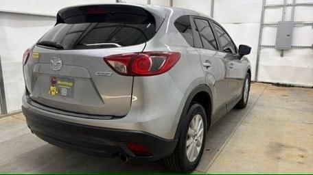 2015 Silver Mazda CX-5 Sport (JM3KE2BE0F0) with an 2.0L I-4 DI DOHC engine, located at 1806 Veterans Memorial Hwy SW, Austell, GA, 30168, (770) 944-9558, 33.817959, -84.606987- Photo#5
