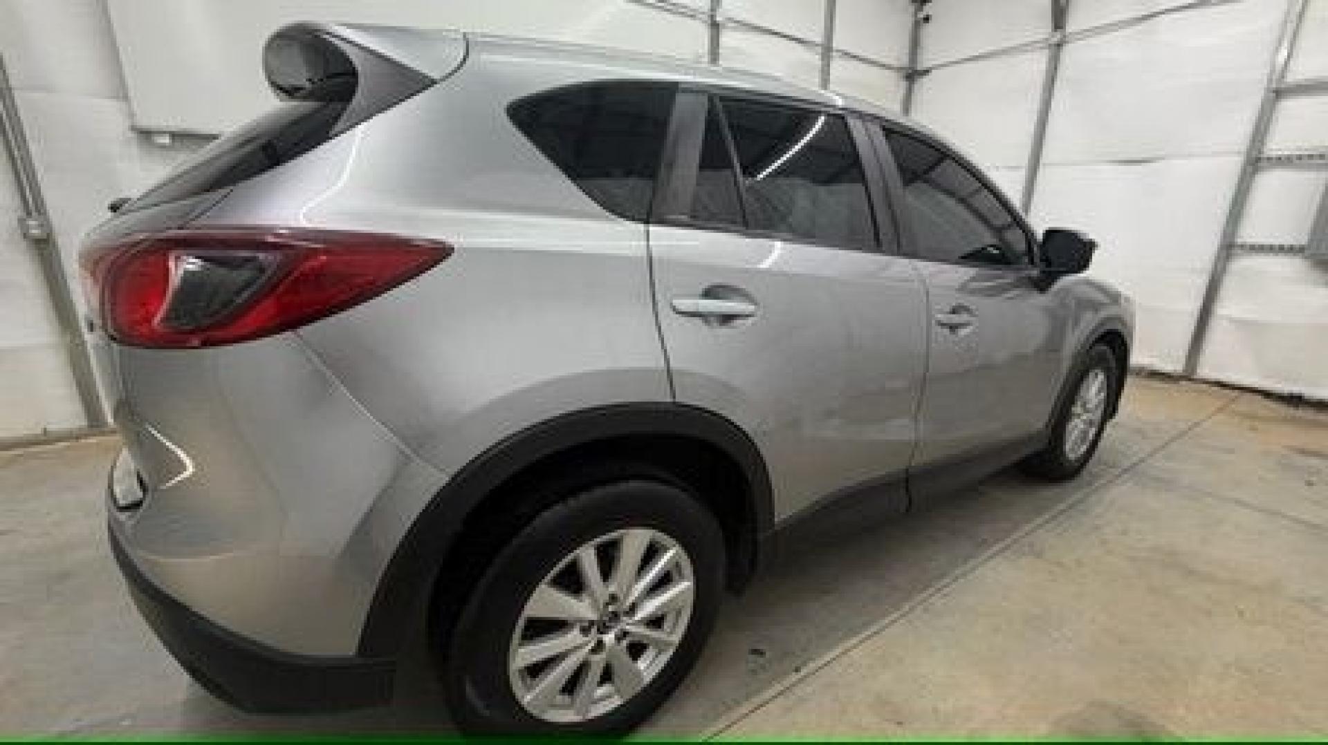 2015 Silver Mazda CX-5 Sport (JM3KE2BE0F0) with an 2.0L I-4 DI DOHC engine, located at 1806 Veterans Memorial Hwy SW, Austell, GA, 30168, (770) 944-9558, 33.817959, -84.606987- Photo#6