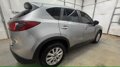 2015 Silver Mazda CX-5 Sport (JM3KE2BE0F0) with an 2.0L I-4 DI DOHC engine, located at 1806 Veterans Memorial Hwy SW, Austell, GA, 30168, (770) 944-9558, 33.817959, -84.606987- Photo#6