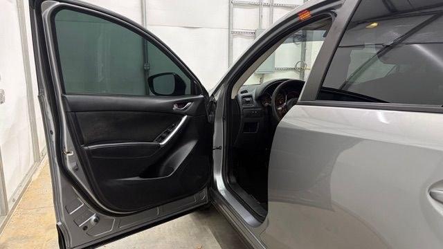 2015 Silver Mazda CX-5 Sport (JM3KE2BE0F0) with an 2.0L I-4 DI DOHC engine, located at 1806 Veterans Memorial Hwy SW, Austell, GA, 30168, (770) 944-9558, 33.817959, -84.606987- Photo#10