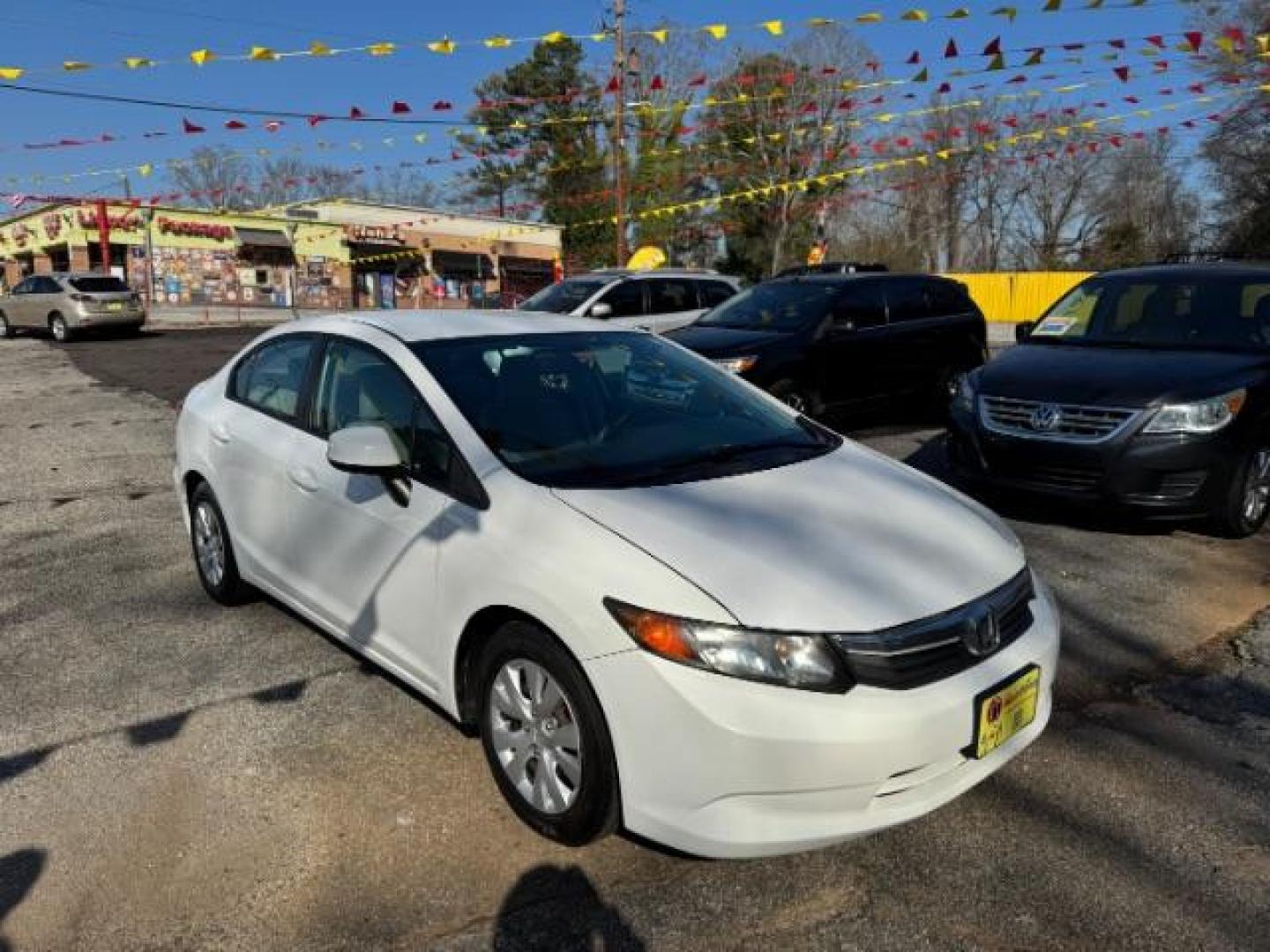2012 White Honda Civic LX (2HGFB2F59CH) with an 1.8L I-4 MPI SOHC engine, located at 1806 Veterans Memorial Hwy SW, Austell, GA, 30168, (770) 944-9558, 33.817959, -84.606987 - Photo#1